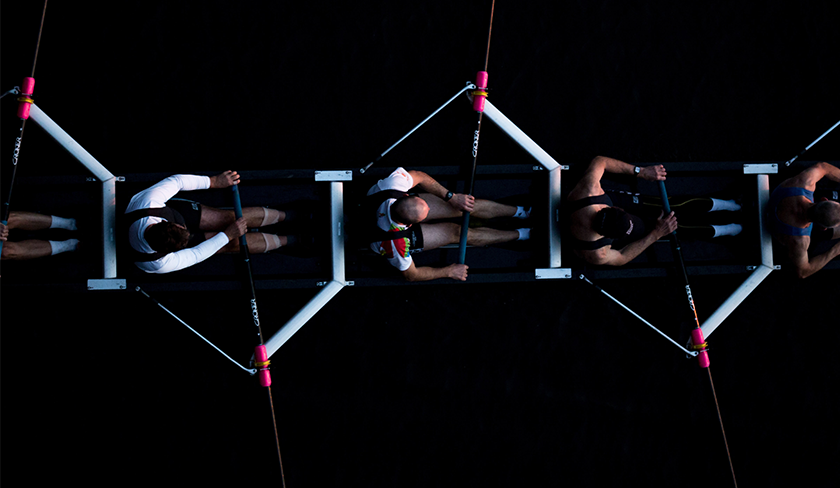 Aerial shot of rowers on the water