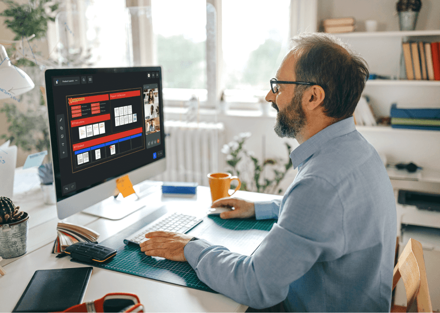 Photo - Creative - Man at desk in video meeting 2